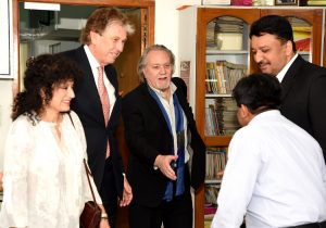 Dr. Kenneth Salyer, Mrs. Salyer and Mr. Russell Martin greet the center’s staff and team
