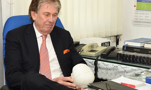 Dr. Salyer keenly seeing the advanced 3D printing technology