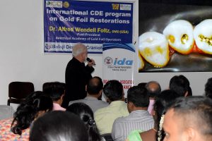 Prof Foltz delivering his keynote lecture on direct gold foil restorations at the CDE program