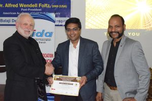 Prof. Foltz presenting a certificate of appreciation to Dr. A.P. Maheshwar, Immediate Past President, Indian Dental Association-Madras Branch, one of the faculty at the program