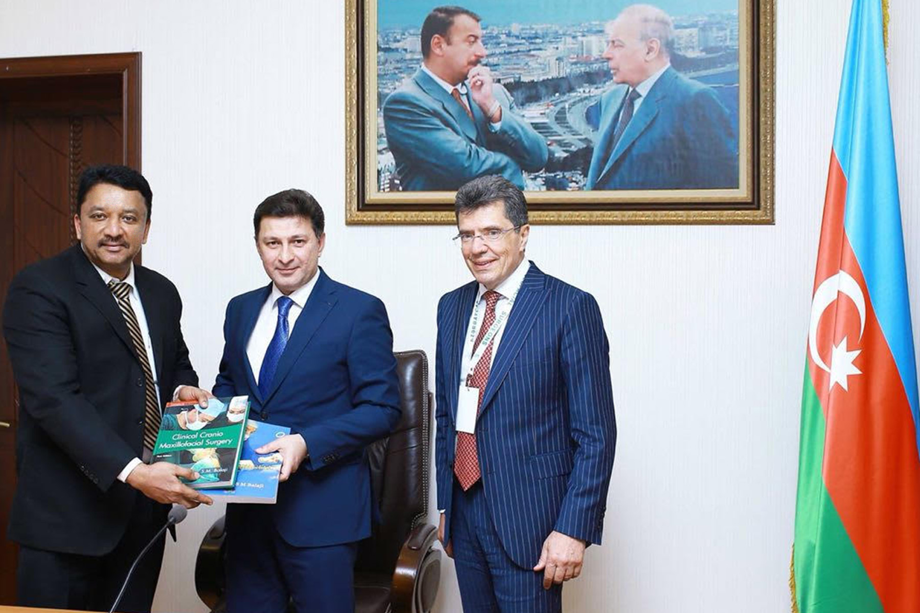 – Dr SM Balaji presenting the Rector, His Excellency Dr Garay Chingiz Garaybayli with a copy of his Clinical Craniomaxillofacial Surgery book