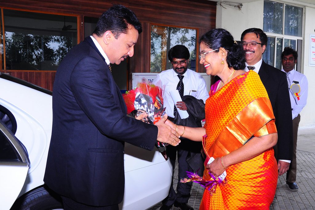 Prof SM Balaji being warmly greeted upon arrival at the college by senior staff members
