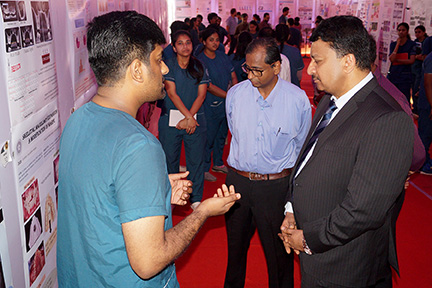 Dr SM Balaji engrossed in the student’s presentation at the poster competition