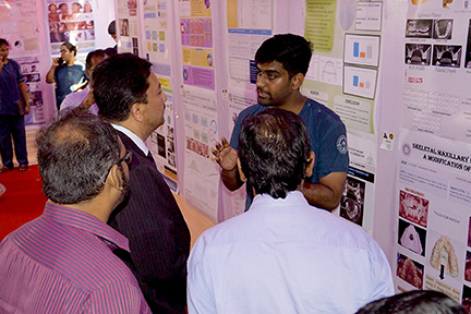 Dr SM Balaji at the poster presentation competition at the STAR Summit in Saveetha Dental College
